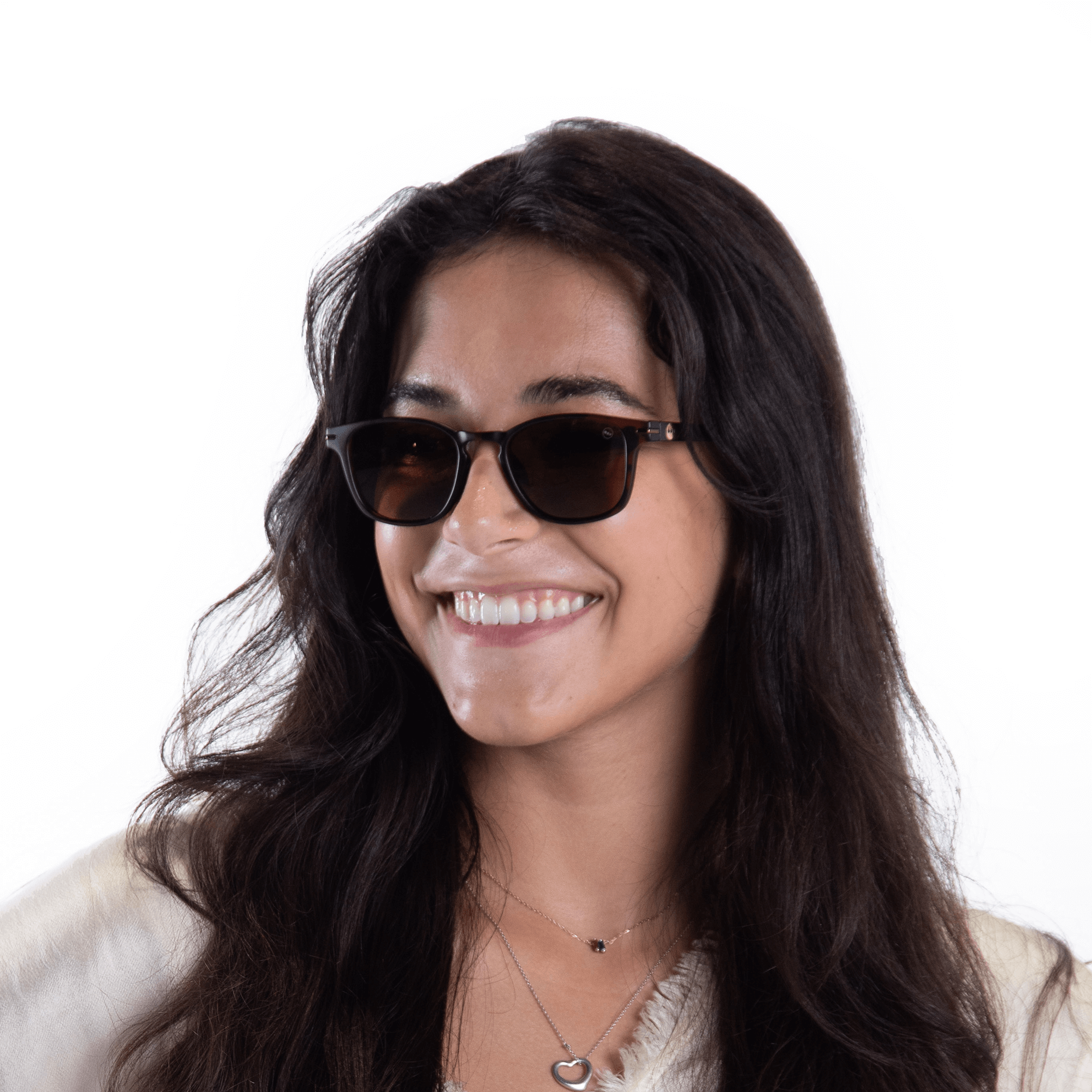 A female model wearing Honeydew Caramel sunglasses, size small.