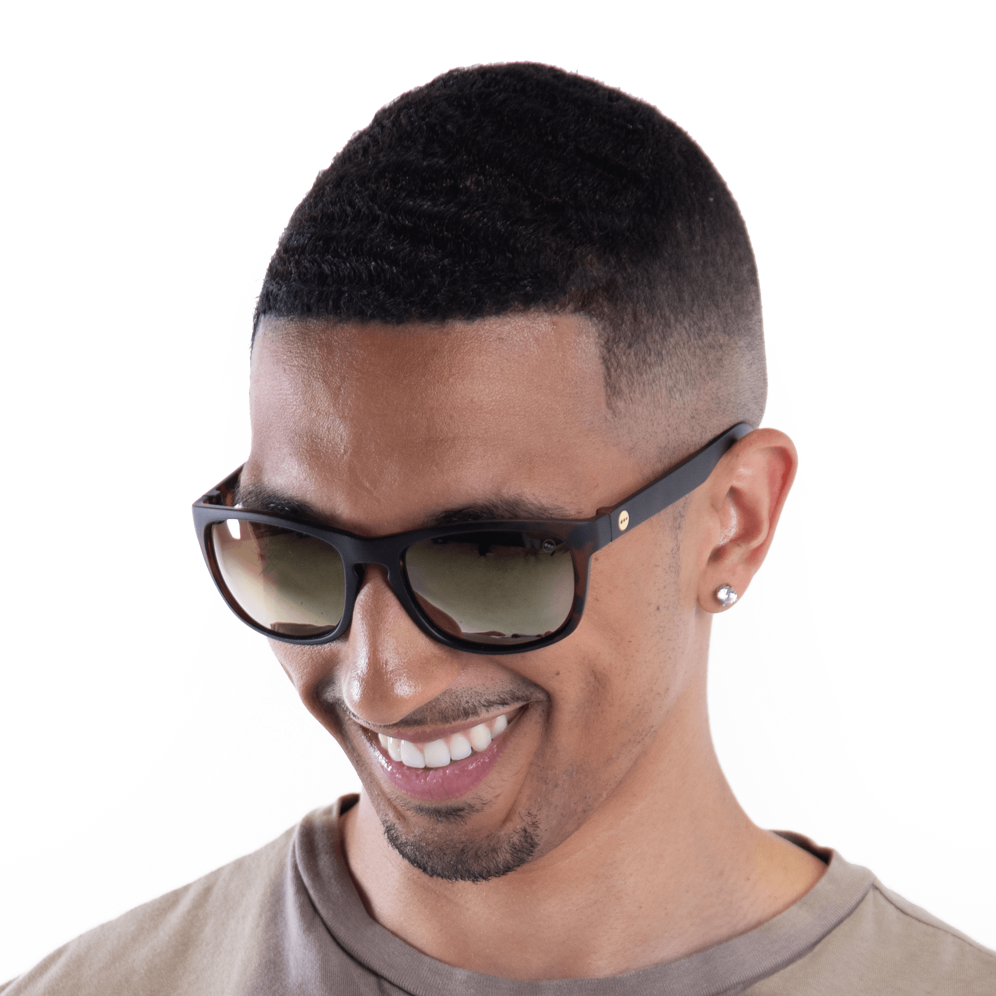 A male model wearing Sugar Butterscotch sunglasses, size small.
