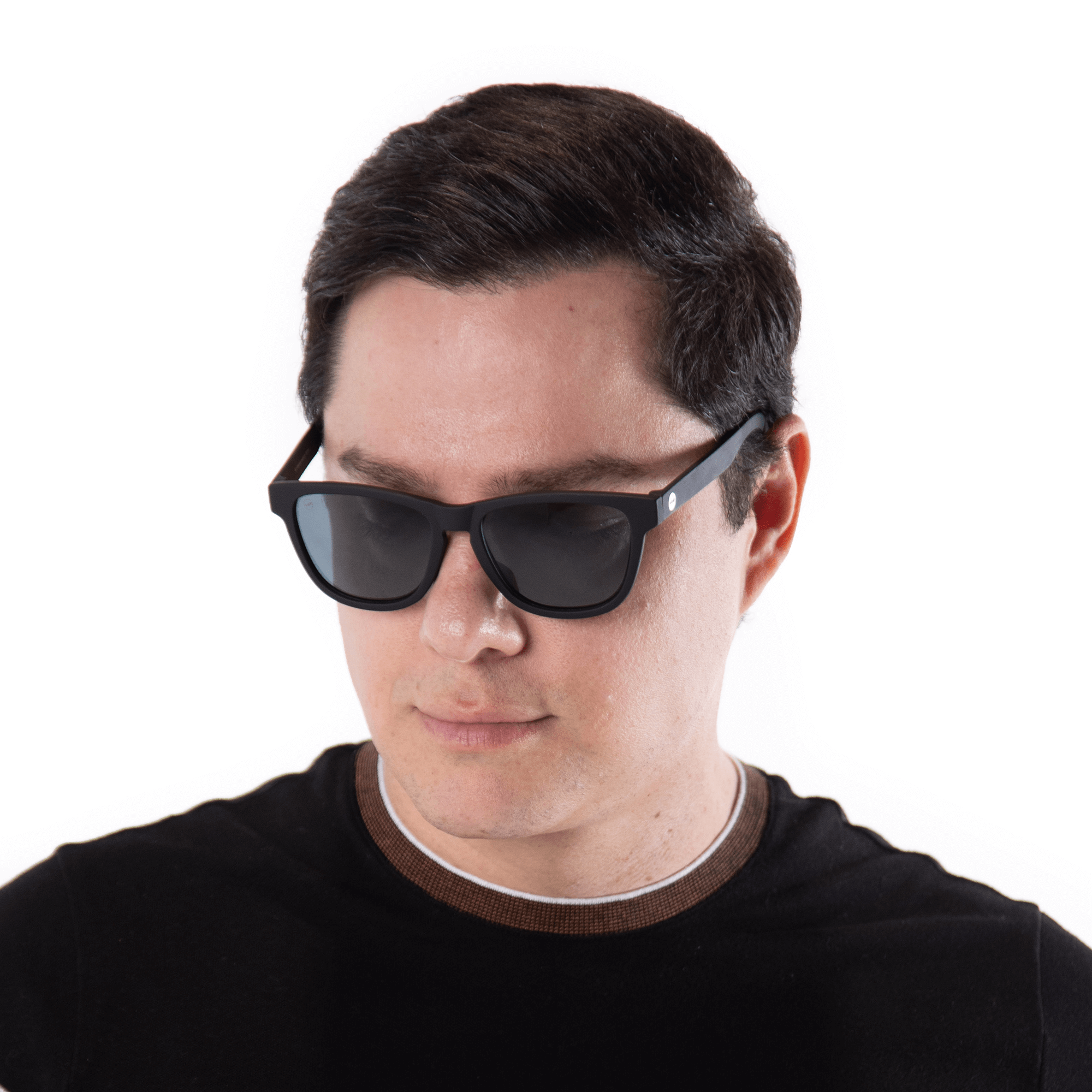 A male model wearing Valencia Blackberry sunglasses, size large-XL.