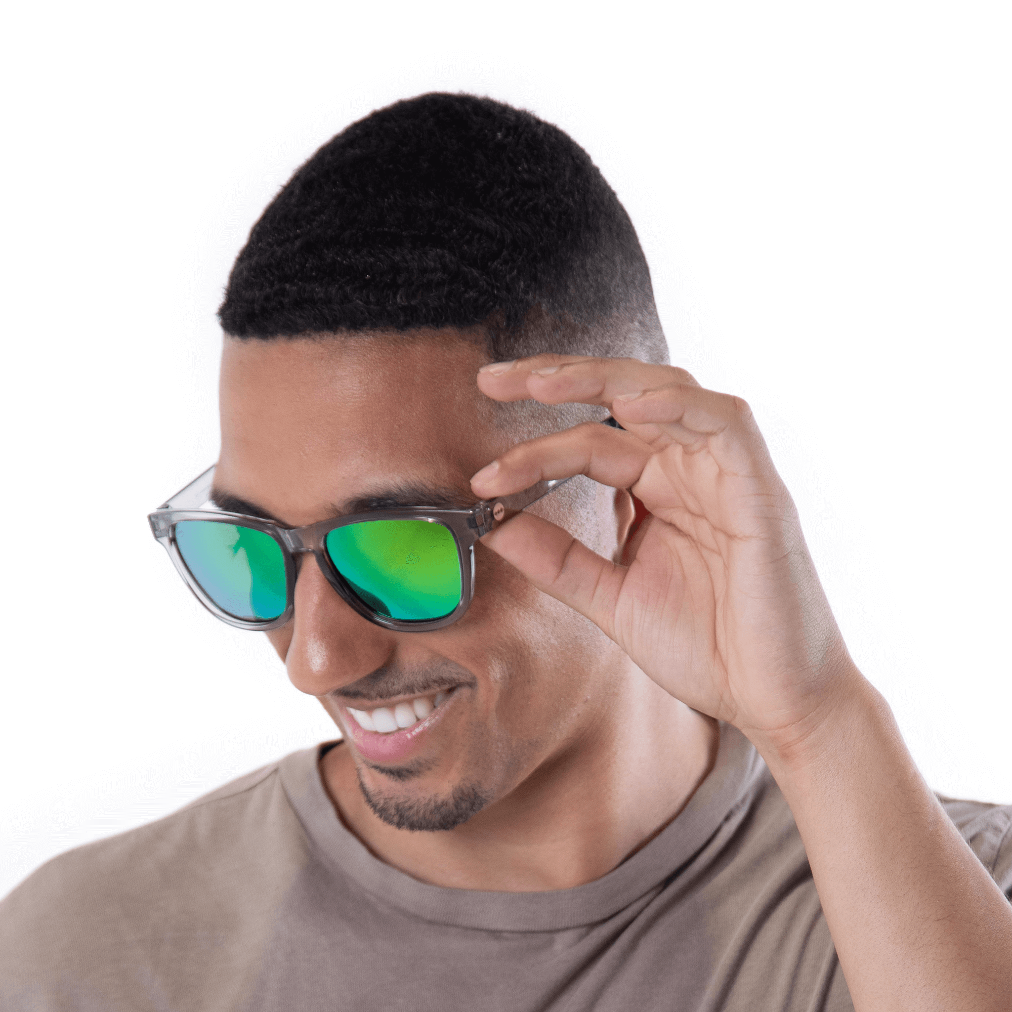 A male model wearing Valencia Mint sunglasses, size small.