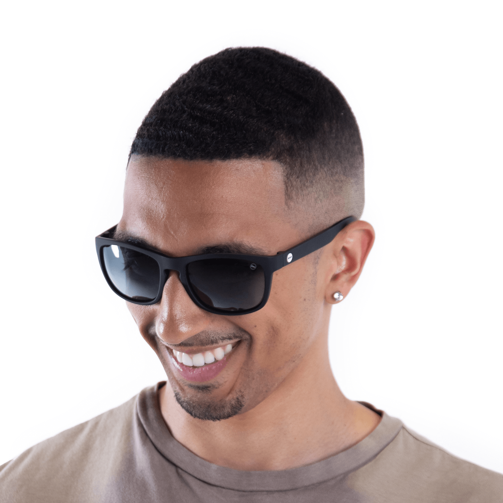 A male model wearing Sugar Blackberry sunglasses, size small.